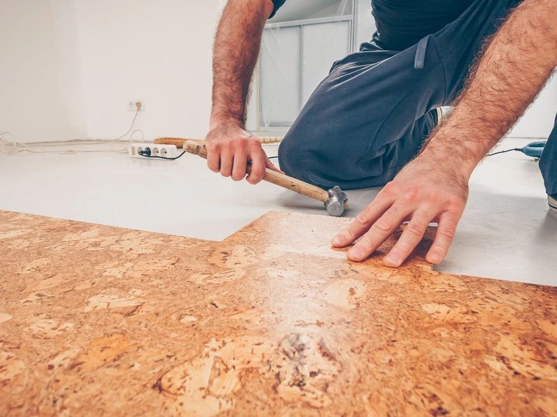 person installing cork flooring from Carpet Depot Inc in the North Hollywood, CA area